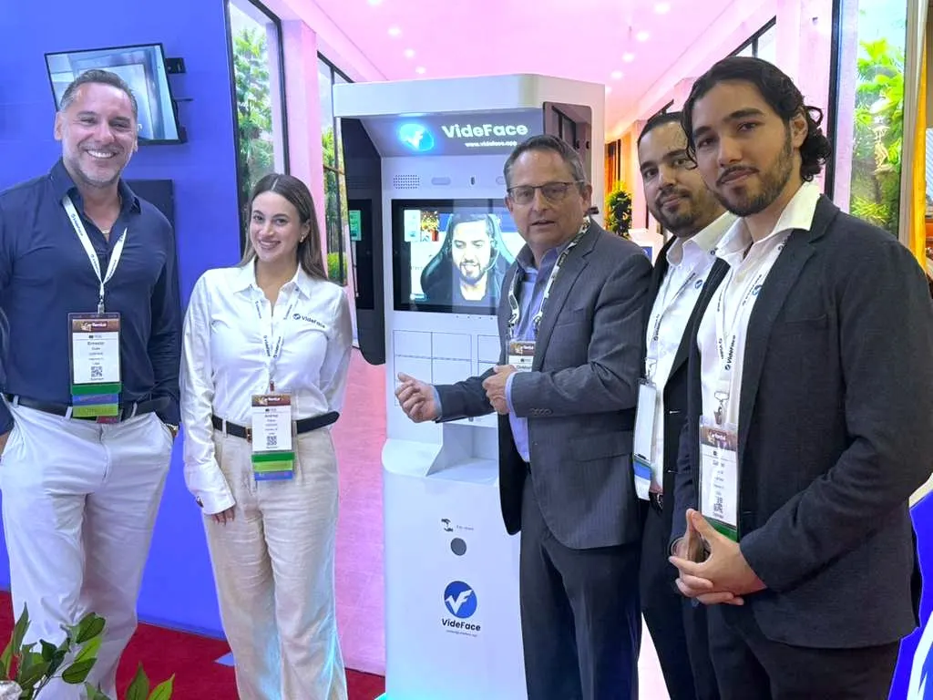 VideFace team with an industry leader at the kiosk, ICRS 2026